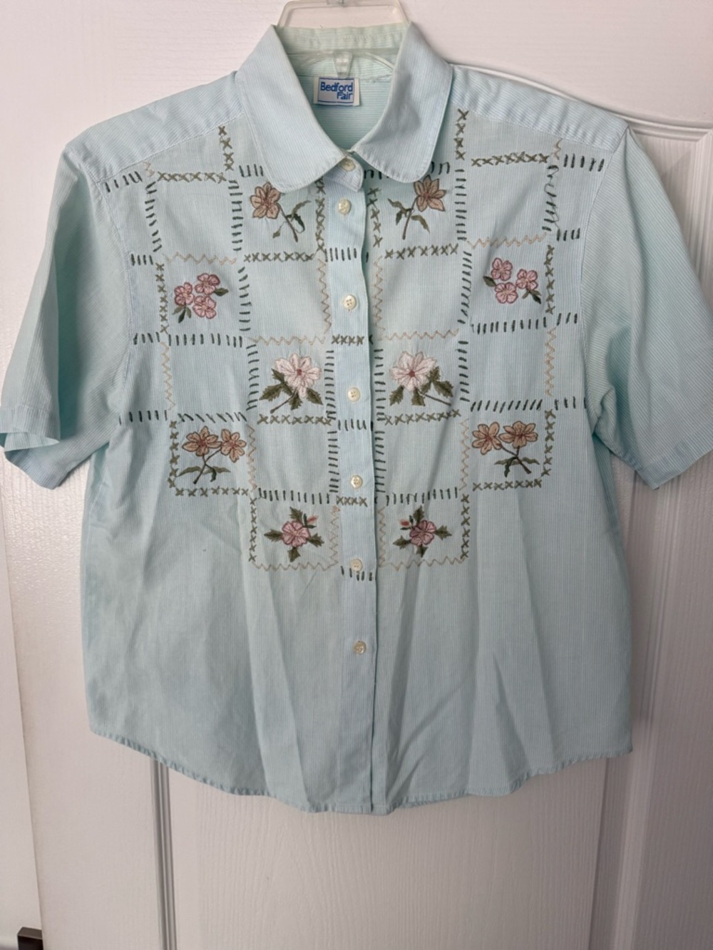 Bedford Fair mint green cotton top with intricate flower stitching.